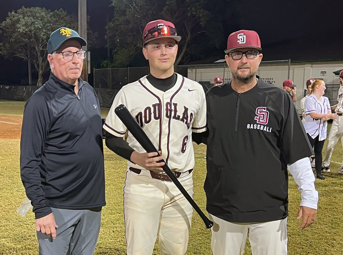 Niko Benestad (center) was named MVP photo BCAA Tournament. He posed with Pat McQuaid (left) and Stoneman Douglas head coach Todd Fitz-Gerald. (3/1/2024)